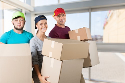 Boxes and household items arranged in a West Drayton storage space