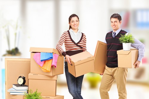 Packed self storage unit in Westdrayton with organized boxes and furniture