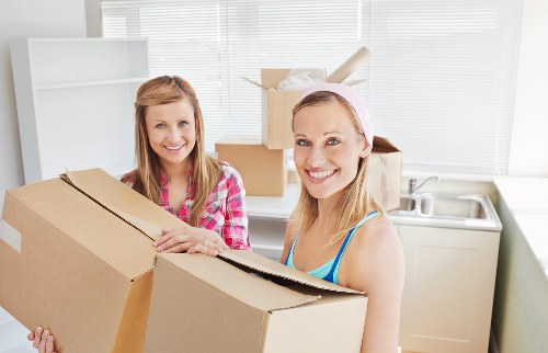 Moving team packing household items for removals in Westdrayton
